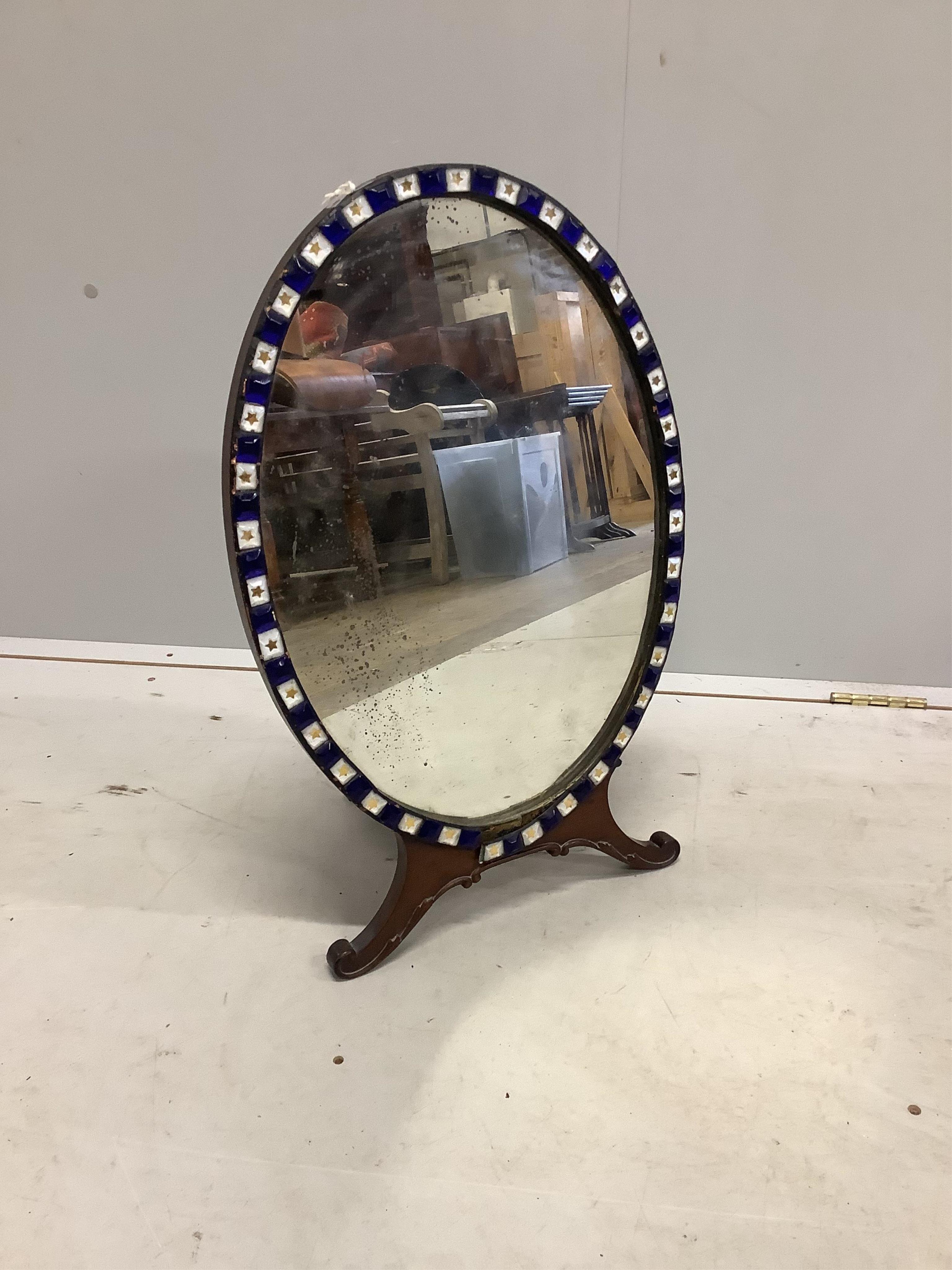 An Irish style oval strut dressing table mirror, width 40cm, height 64cm. Condition - fair